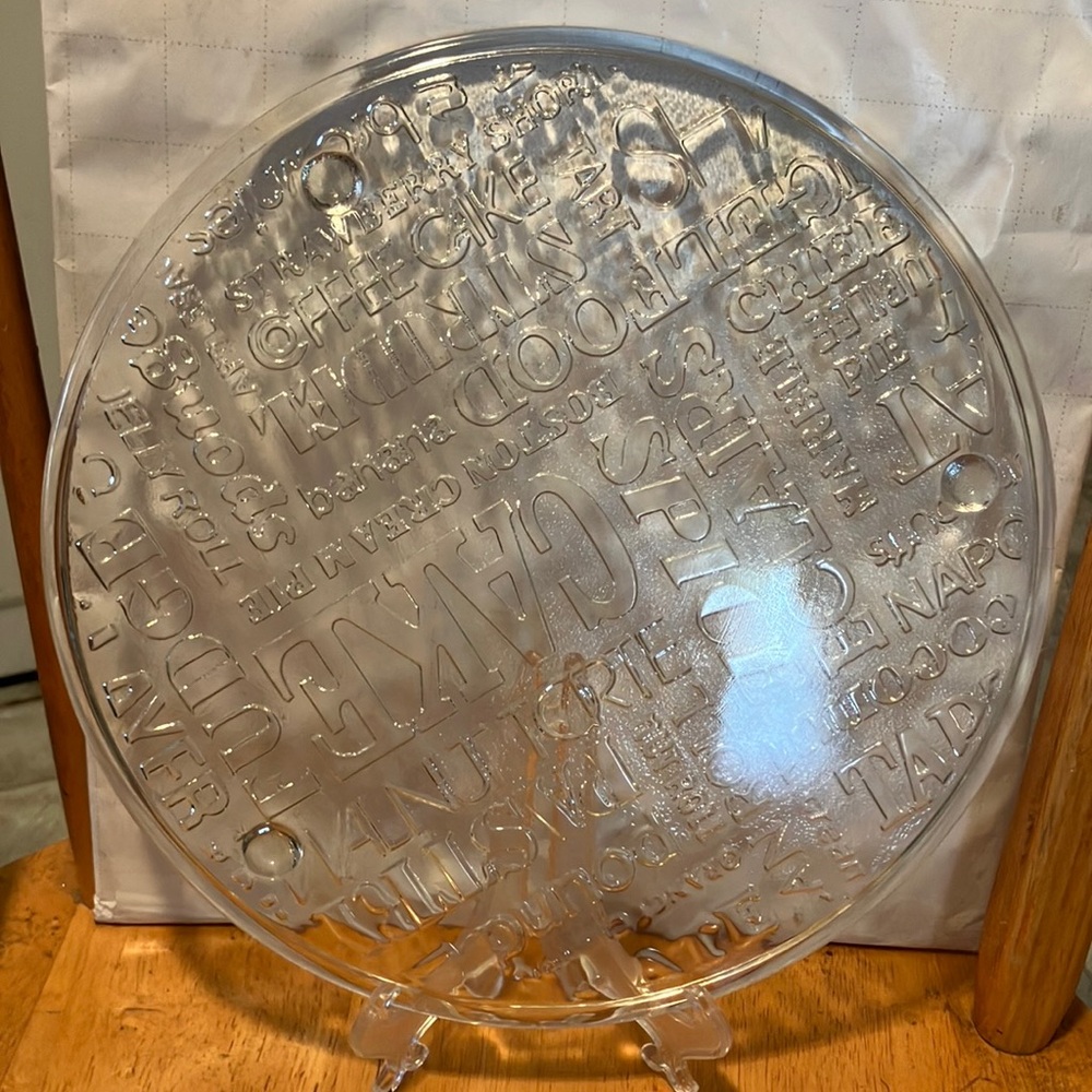Like new. Lovely glass 11” circular cake or pie dish with tiny legs n cut names